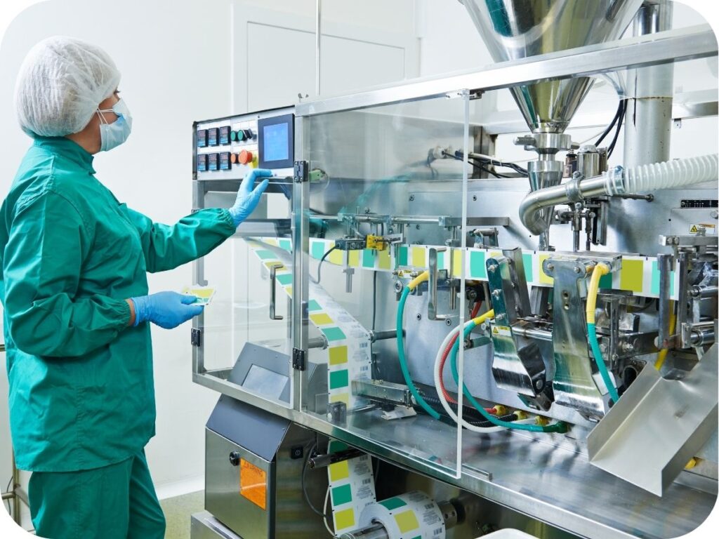 Quality technician monitoring automated herbal supplement manufacturing line